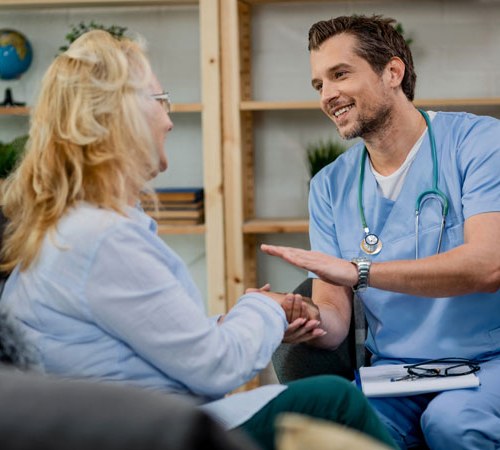 Choices-And-Change Male doctor comforting a woman patient