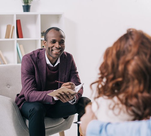 Man and woman in an office having a discussion